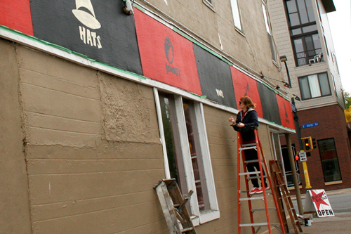 Hannah Haugberg helps to paint Blacklist Vintage storefront